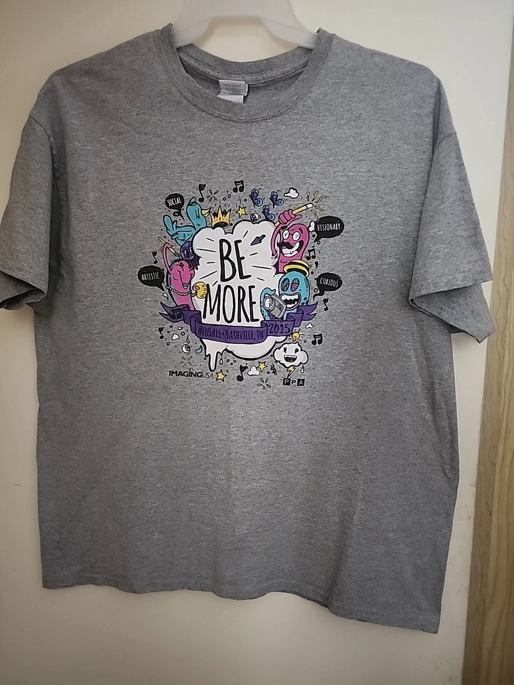 T-Shirt; XL LOGO:--"BE MORE"----SOCIAL; ARTISTIC;VISIONARY; CURIOUS".IMAGING USA